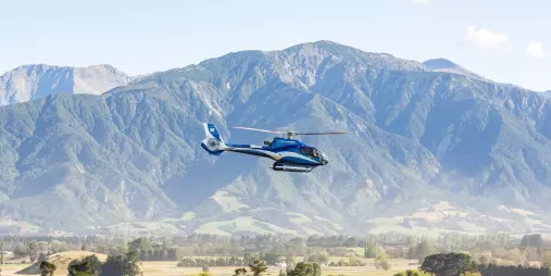 Helicopter flying with Kaikōura’s Seaward Ranges as a stunning backdrop