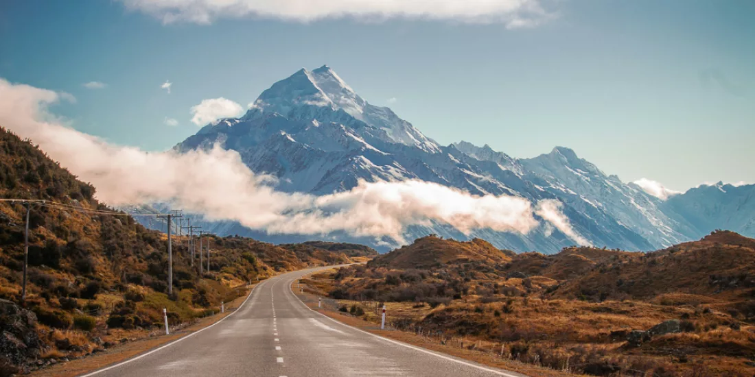 Scenic road leading directly towards Mount Cook on a clear day in the South Island