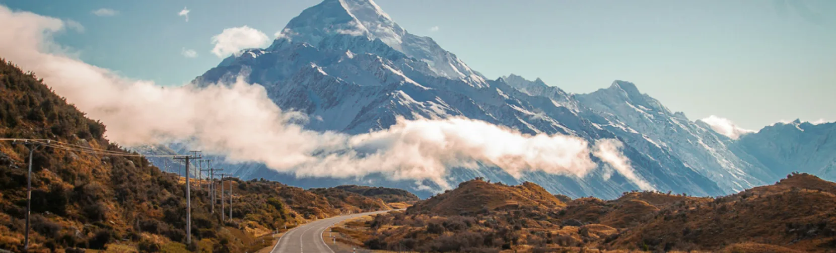Scenic road leading directly towards Mount Cook on a clear day in the South Island