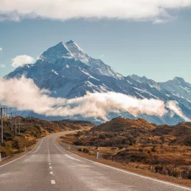 Scenic road leading directly towards Mount Cook on a clear day in the South Island