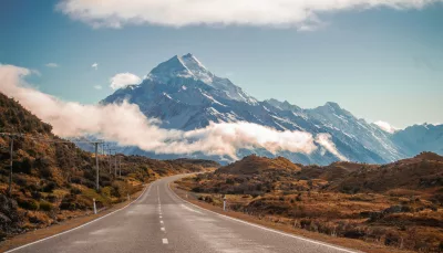 Scenic road leading directly towards Mount Cook on a clear day in the South Island