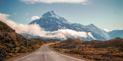 Scenic road leading directly towards Mount Cook on a clear day in the South Island