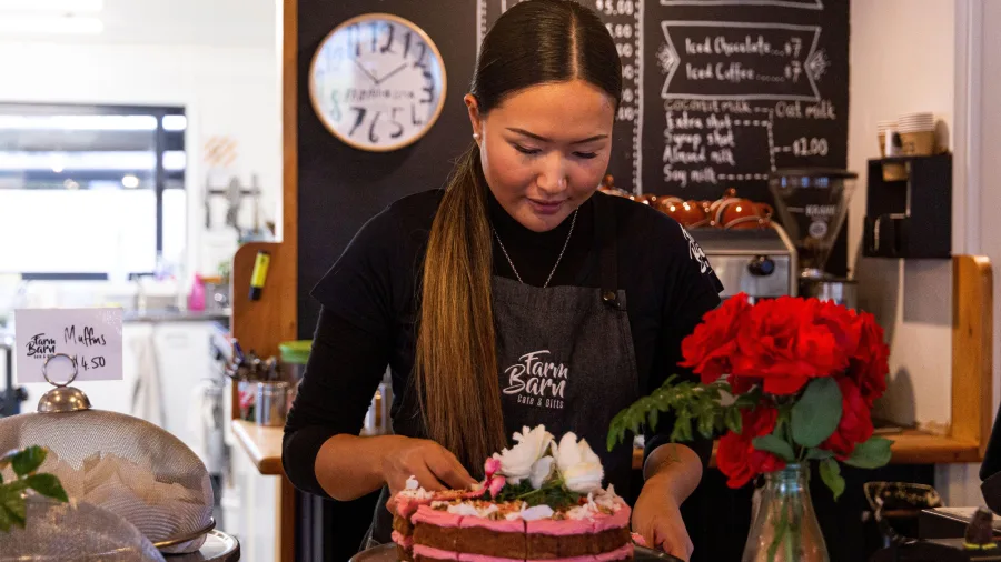 Serving cake at the Farm Barn Café, Fairlie
