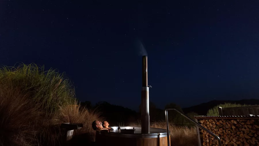 Hot Tubs Ōmarama at night under a star-filled New Zealand sky