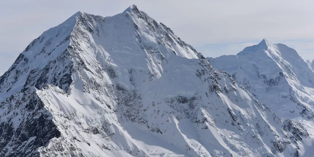 Aerial shot of Aoraki/Mt Cook’s snow-covered summit and rugged alpine peaks