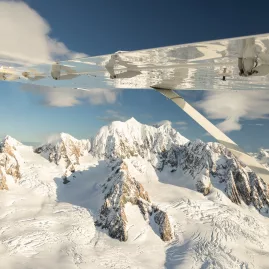 Aerial view of Mount Tasman and the Fox Glacier Névé during a Grand Traverse scenic flight over the Southern Alps.
