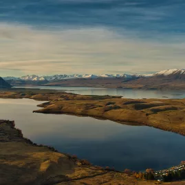 Overhead view of Lake Alexandrina and Lake Tekapo with Southern Alps in the distance
