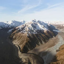Expansive aerial view of Tasman Glacier and the Burnett Mountains with glacial moraine