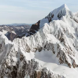 Aerial view of Mt Tasman and the Hochstetter Icefall covered in deep alpine snow