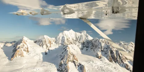 Aerial view of Mount Tasman and the Fox Glacier Névé during a Grand Traverse scenic flight over the Southern Alps.