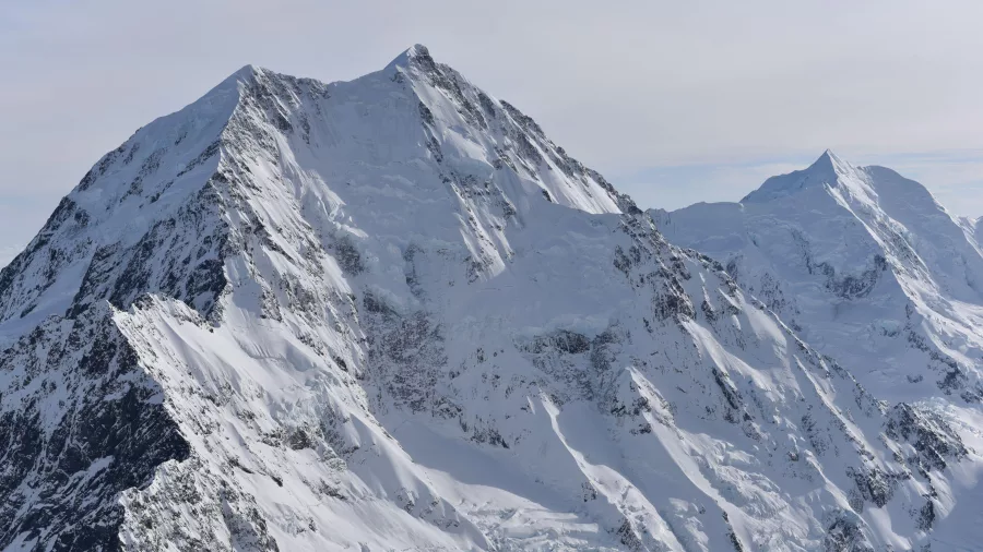 Aerial shot of Aoraki/Mt Cook’s snow-covered summit and rugged alpine peaks