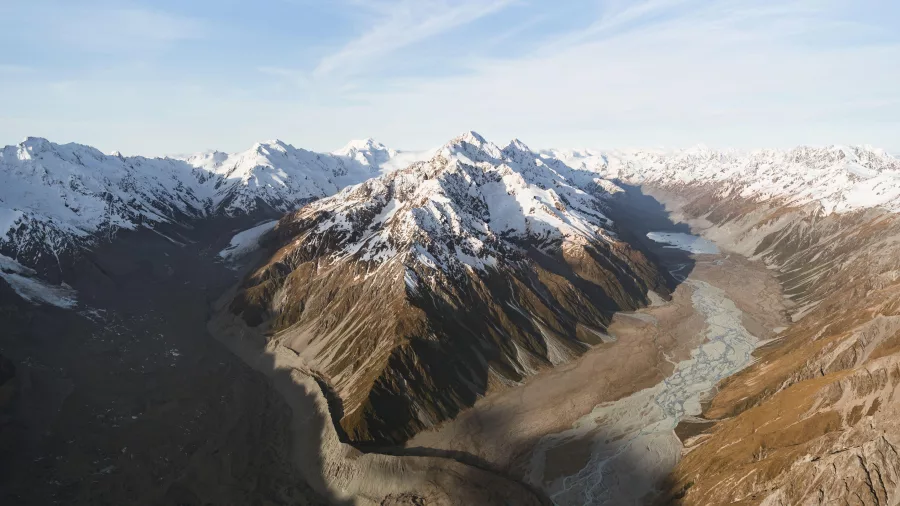 Expansive aerial view of Tasman Glacier and the Burnett Mountains with glacial moraine