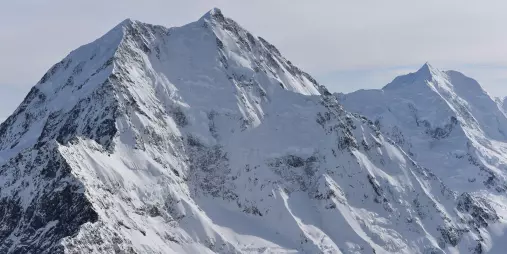 Aerial shot of Aoraki/Mt Cook’s snow-covered summit and rugged alpine peaks