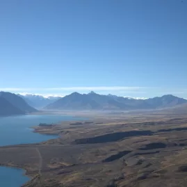 Vast landscape view looking towards the Southern Alps and Lake Tekapo from Mount Hay trail