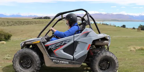 Polaris ATV navigating high-country terrain on Mount Hay Station