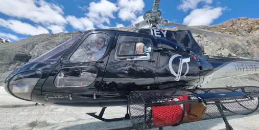Close-up of passengers inside an Inflite helicopter during glacier landing