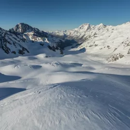 Aerial view of the snow-covered Tasman Glacier stretching through the Southern Alps