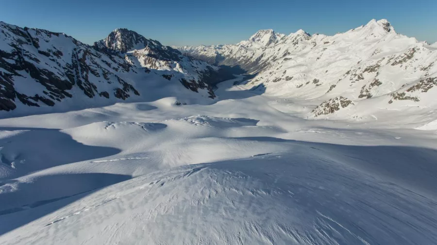Aerial view of the snow-covered Tasman Glacier stretching through the Southern Alps