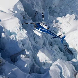 Helicopter flying over the dramatic Hochstetter Icefall near Mount Cook