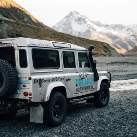 Tekapo Adventures 4WD driving through rugged backcountry towards alpine mountains