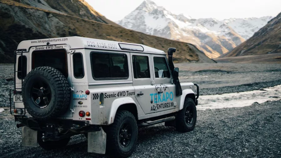 Tekapo Adventures 4WD driving through rugged backcountry towards alpine mountains