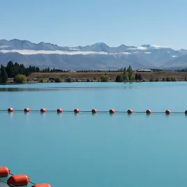 Clear water and mountain backdrop at the salmon farm in Twizel, South Island