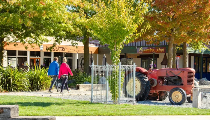 Twizel town centre with autumn colours and vintage tractor