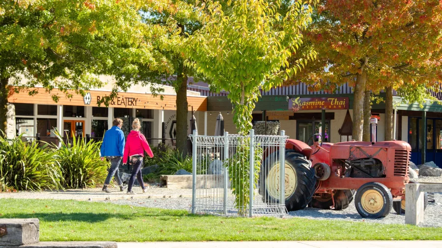 Twizel town centre with autumn colours and vintage tractor