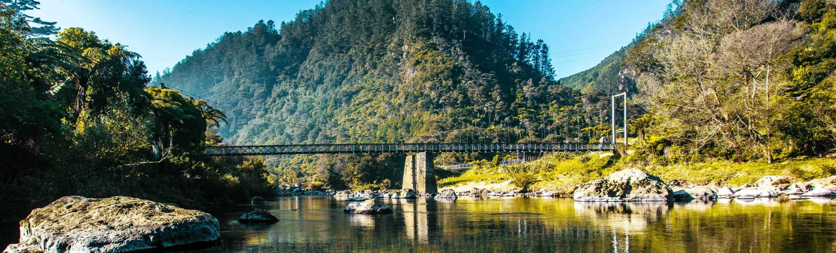 Swing bridge over river in Karangahake Gorge