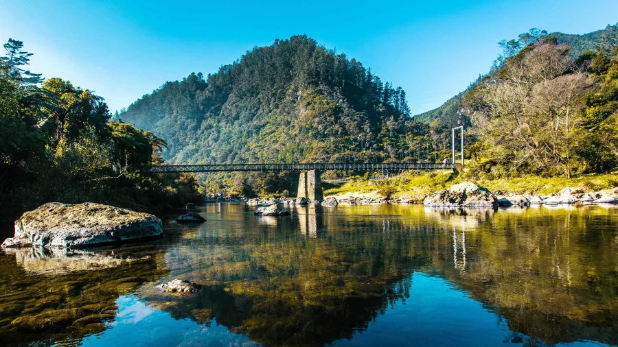 Swing bridge over river in Karangahake Gorge