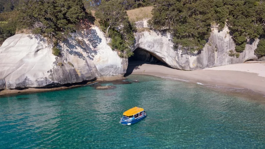 Glass Bottom Boat near the sea cave entrance at Cathedral Cove beach