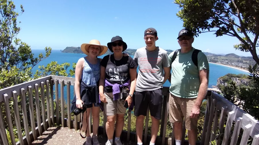 Family group at Shakespeare Cliff Lookout with view over Cook’s Beach, Coromandel