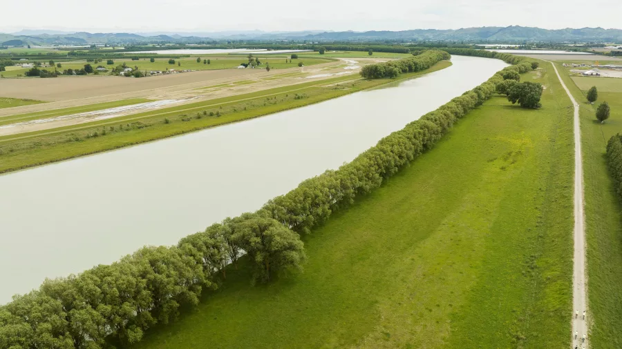 Drone view of the Waipaoa River trail with cyclists riding along the riverside