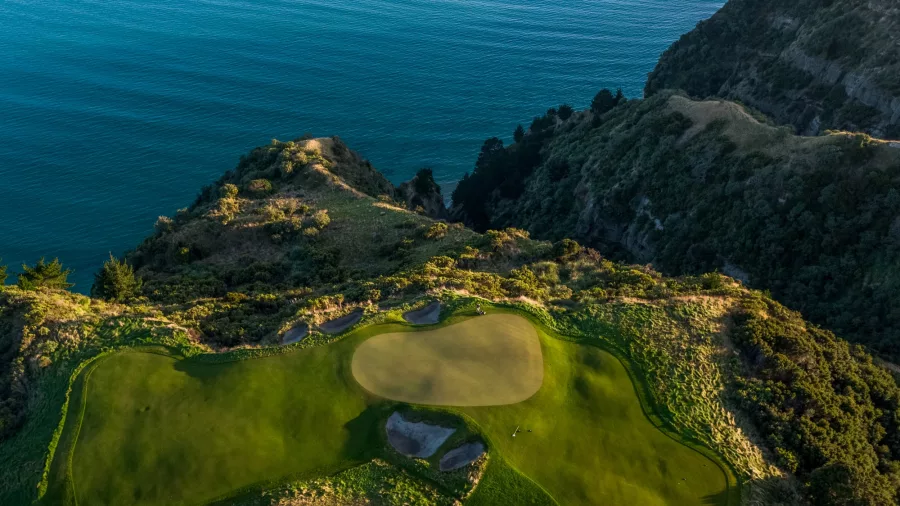 Aerial view of a green perched on the cliffs at Cape Kidnappers golf course in Hawke’s Bay
