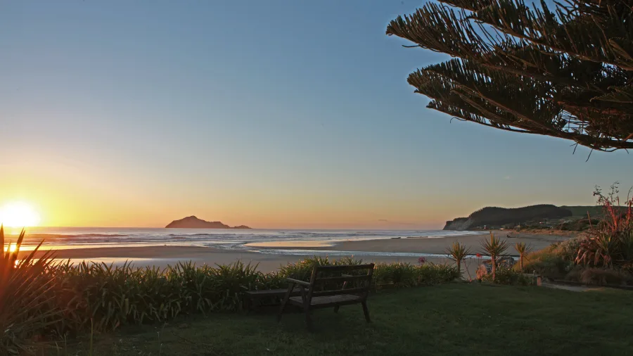 Sunrise over Waimarama Beach with Bare Island near Hastings in Hawke’s Bay