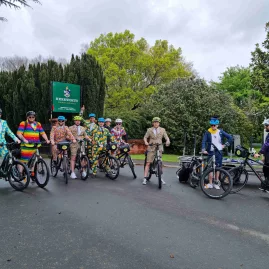 Group of cyclists in colourful fancy dress posing on the Hawke’s Bay Cycle Trails