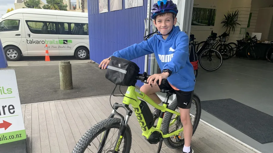 Young rider ready to explore with a mountain bike from Takaro Trails bike hire in Napier