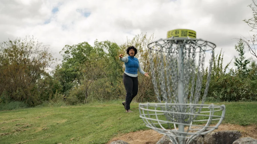 Player aiming for a disc golf basket in Ohakune