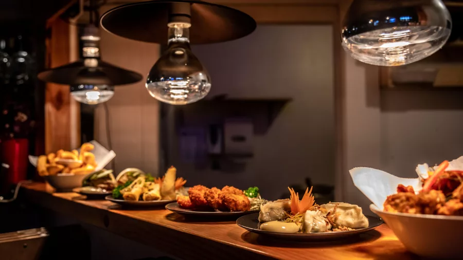 Selection of beautifully plated dishes under warm lighting at Rice Restaurant and Bar, Ohakune