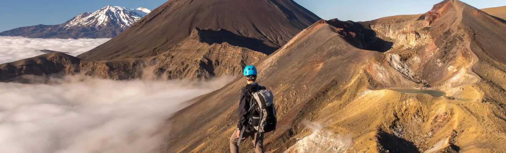 Hiker overlooking Mount Ngauruhoe on the Tongariro Crossing