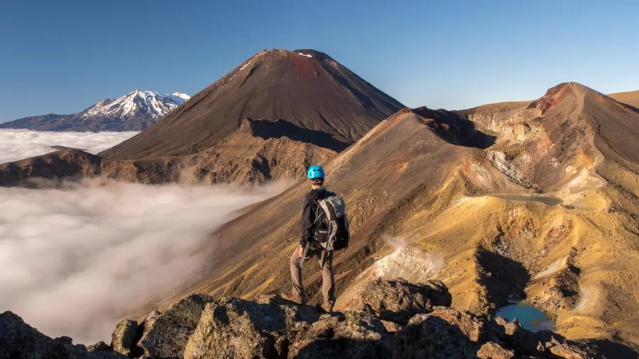Hiker overlooking Mount Ngauruhoe on the Tongariro Crossing