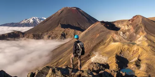 Hiker overlooking Mount Ngauruhoe on the Tongariro Crossing