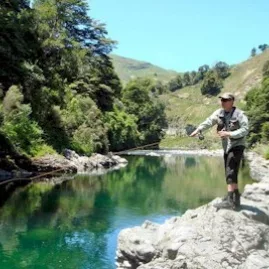 Angler casting from rocks above Storm Rapid on the Rangitikei River