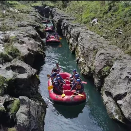 Rafts floating through The Narrows on the Rangitikei River, a dramatic gorge known as Te Papa a Tarinuku