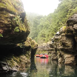 Rafters float through the steep-sided gorge of The Narrows, also known as Te Papa a Tarinuku, on the Rangitikei River