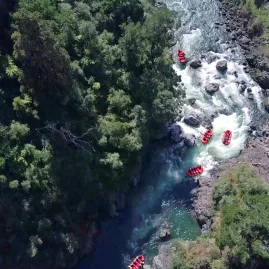 Rafter navigates Storm Rapid, a churning section of white water on the Rangitikei River named after a sudden storm during a past trip