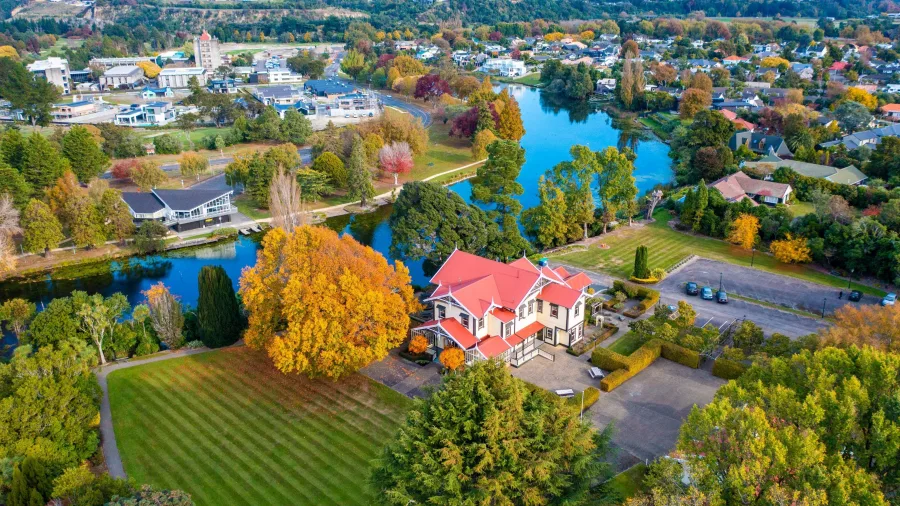 Aerial view of Caccia Birch House and Hokowhitu Lagoon in autumn