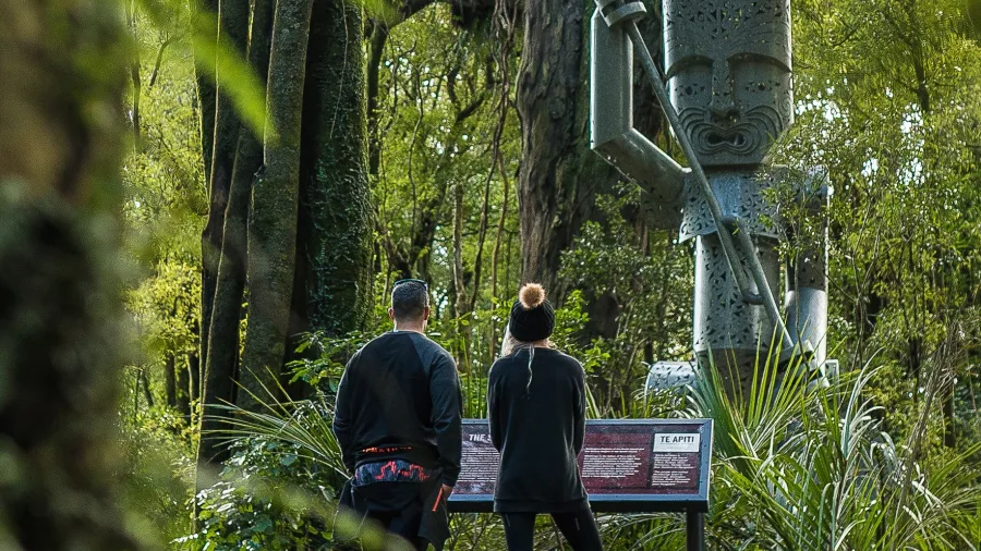 Visitors viewing Whatonga sculpture on Tawa Loop Track