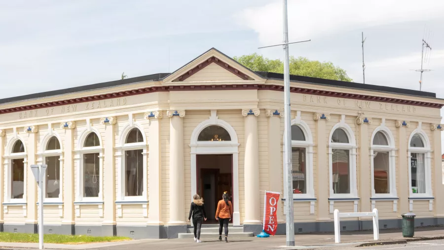 People entering the Raetihi Art Gallery housed in a historic bank building