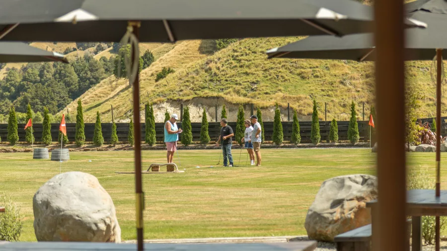 People enjoying a mini putt at Bradley’s Garden in Taumarunui